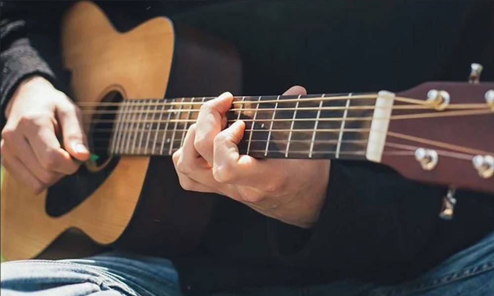 man playing a guitar man playing a guitar