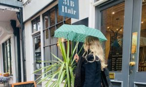 31b Hair Salon exterior lady with an umbrella