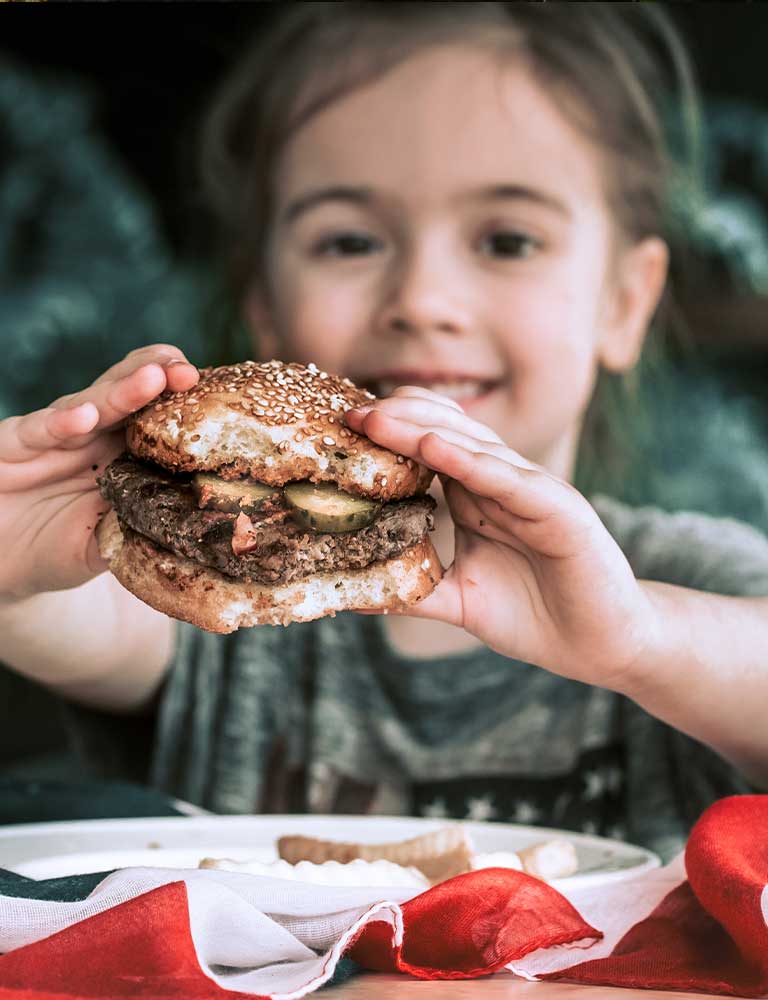 Child eating a burger Child eating a burger