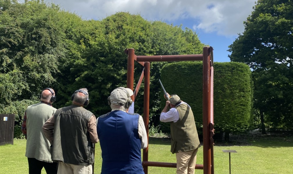 West kent shooting school A group of men practicing shooting targets