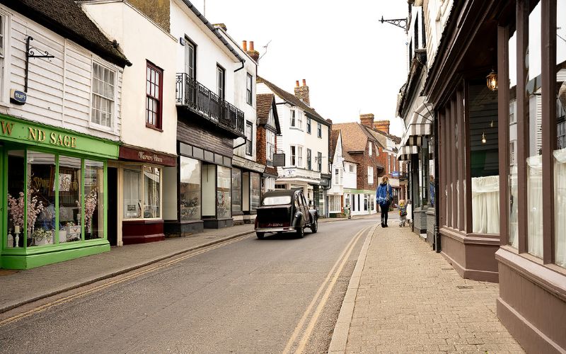 Cranbrook classic car Classic car driving down narrow street