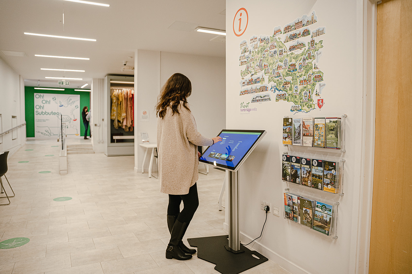 VISIT TUNBRIDGE WELLS Person using a tourist information touchscreen